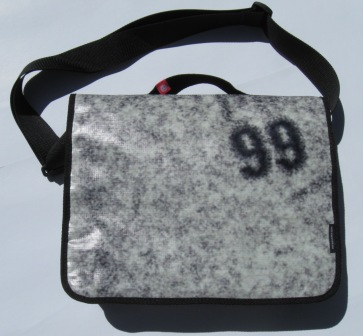 A recycled laptop bag made from Powershop's billboard campaign of Electricity vs Power